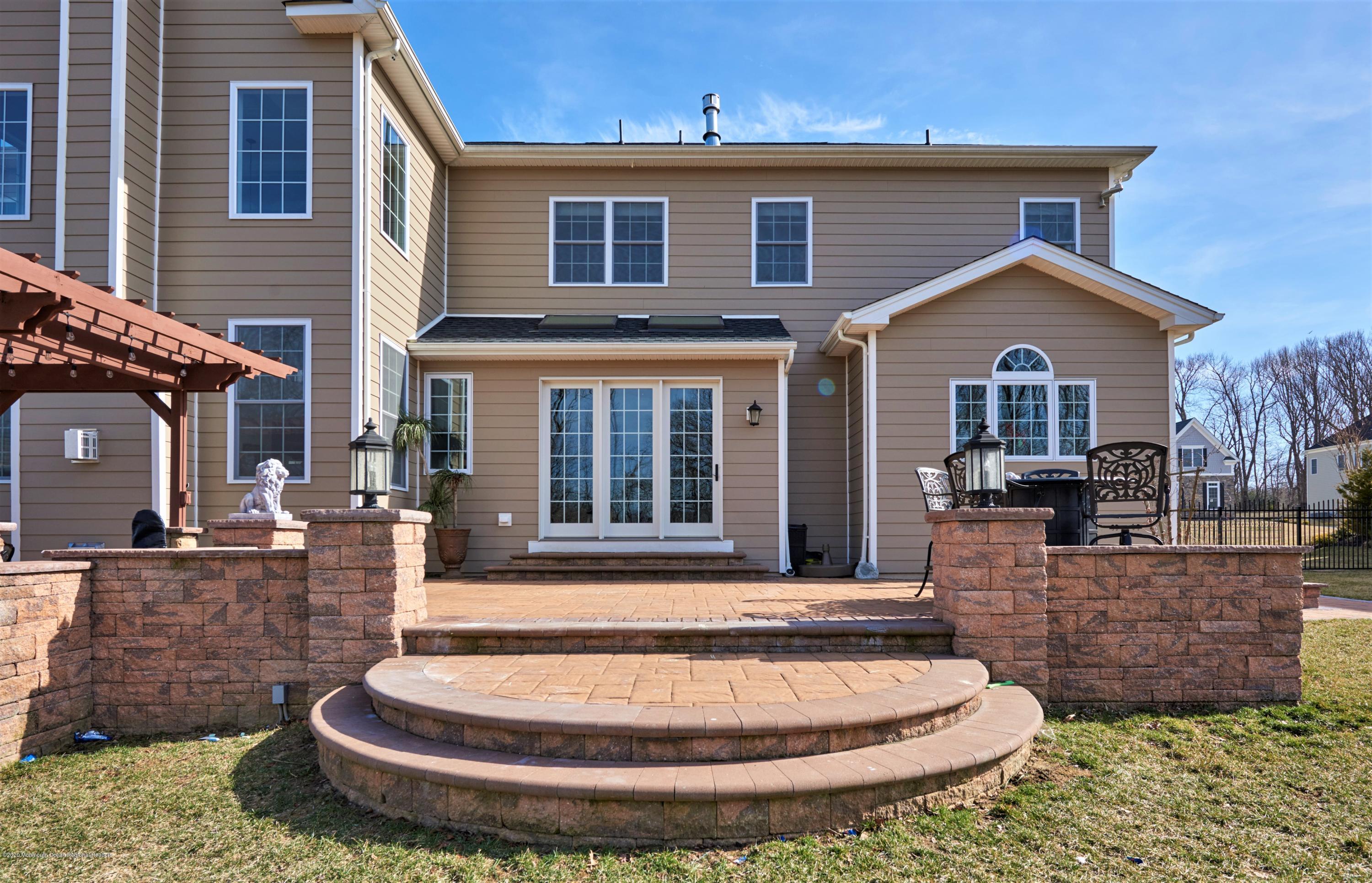 15 Windermere Road Lincroft, NJ 07738 - Photo 49 of 56 a front view of a house with entertaining space