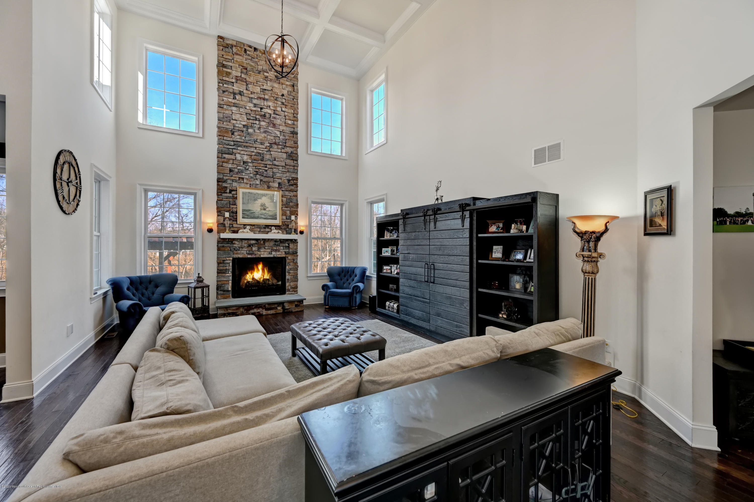 15 Windermere Road Lincroft, NJ 07738 - Photo 5 of 56 a living room with furniture a fireplace and a flat screen tv