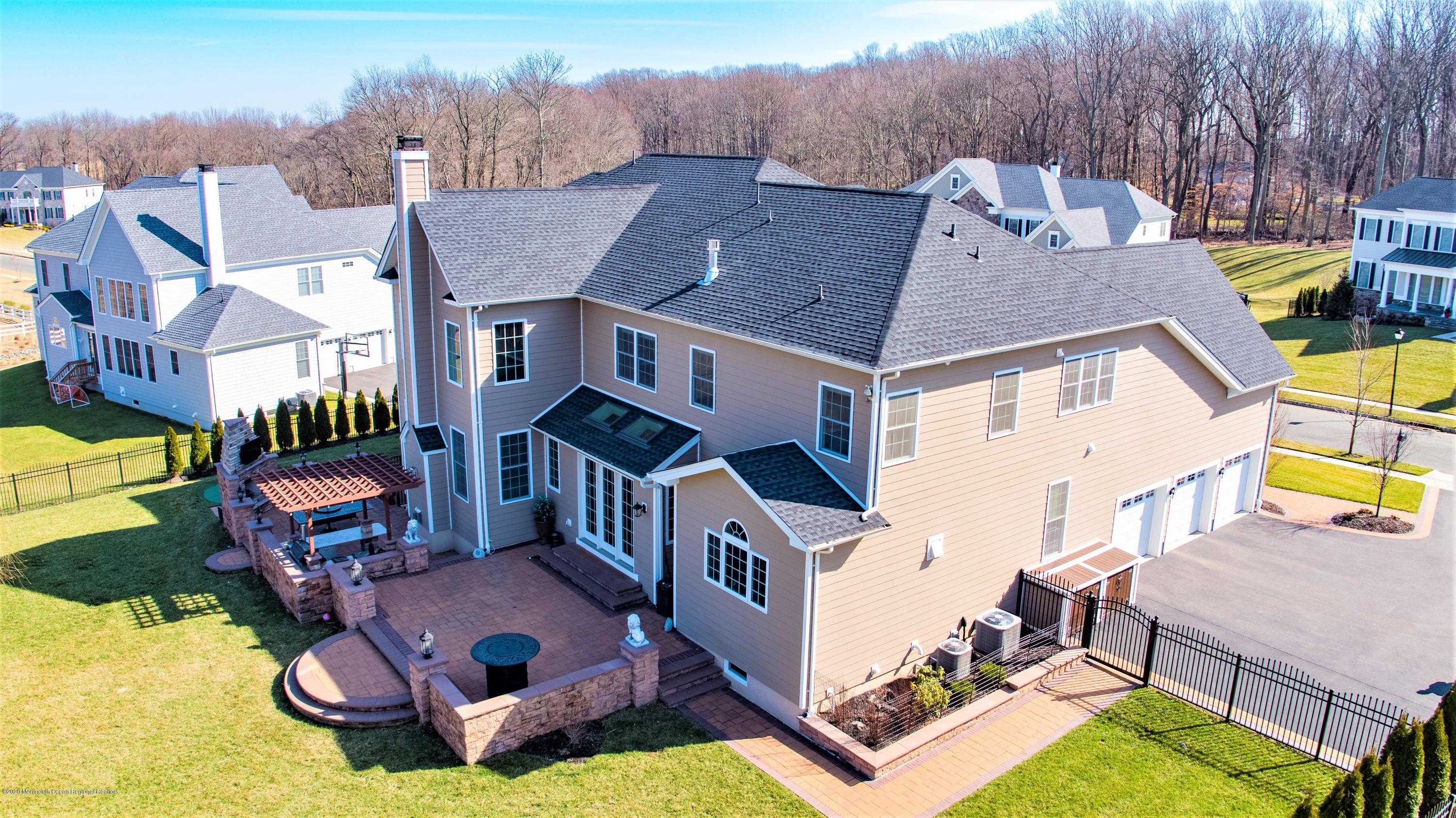 15 Windermere Road Lincroft, NJ 07738 - Photo 54 of 56 an aerial view of a house with a big yard