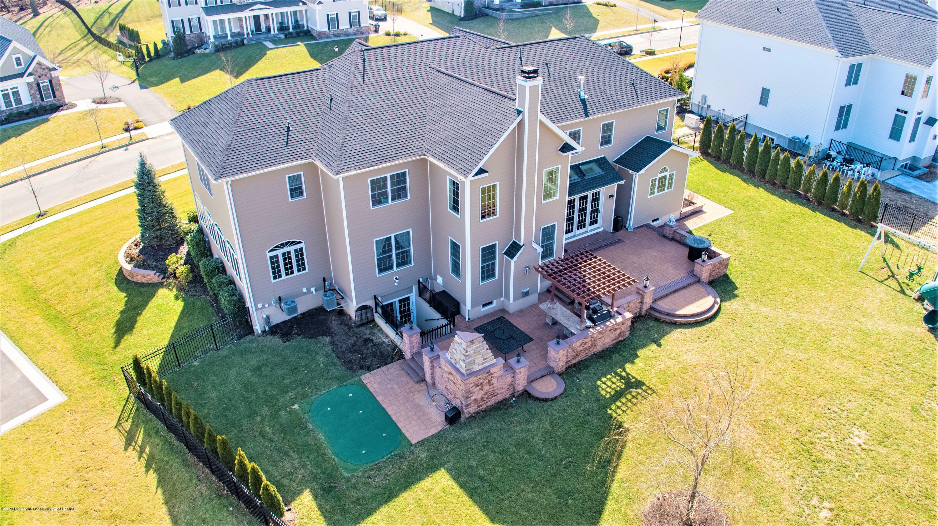 15 Windermere Road Lincroft, NJ 07738 - Photo 55 of 56 an aerial view of a house with swimming pool
