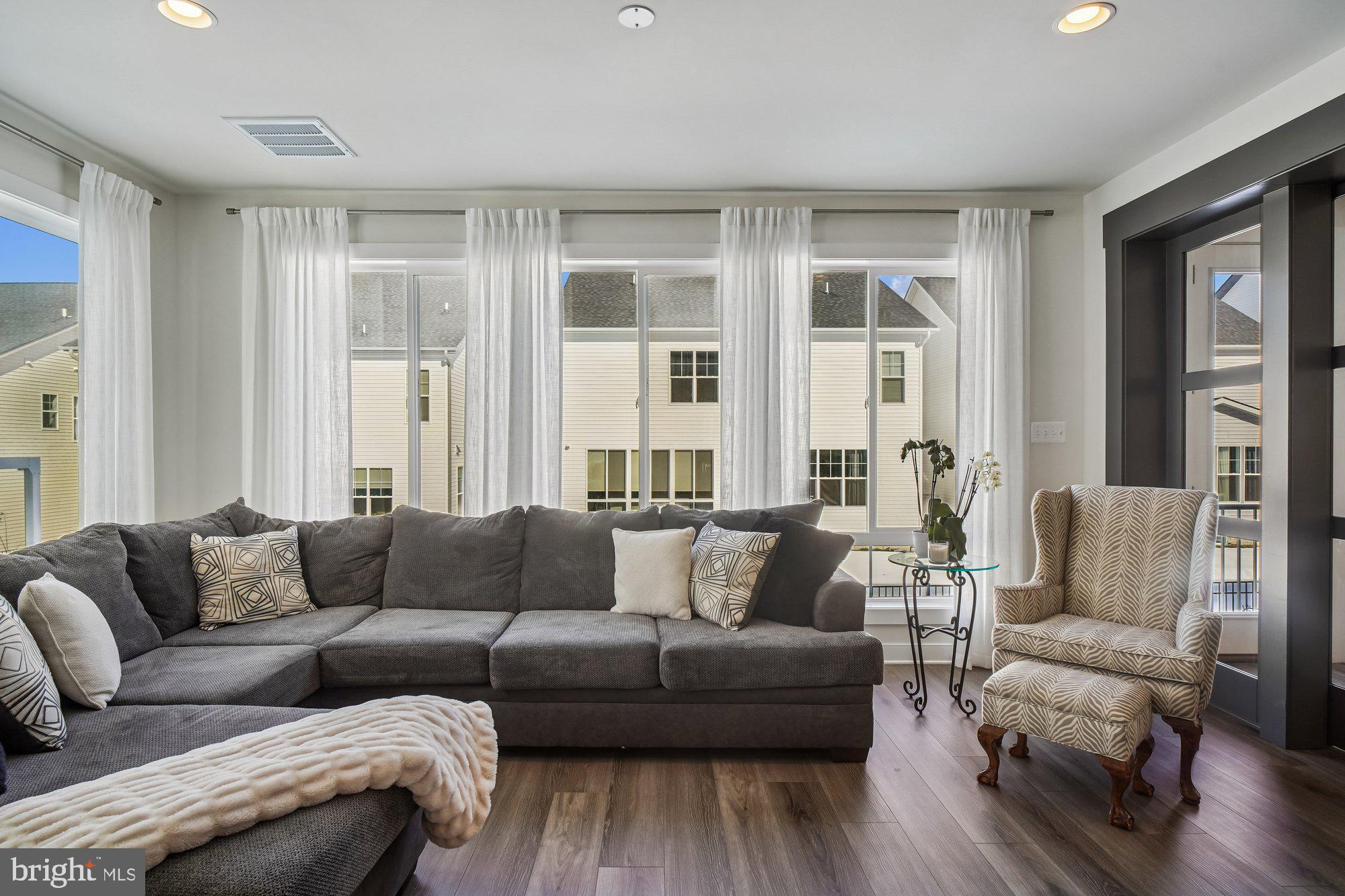 8776 Walnut Btm Lane Frederick, MD 21701 - Photo 11 of 39 a living room with furniture and a large window