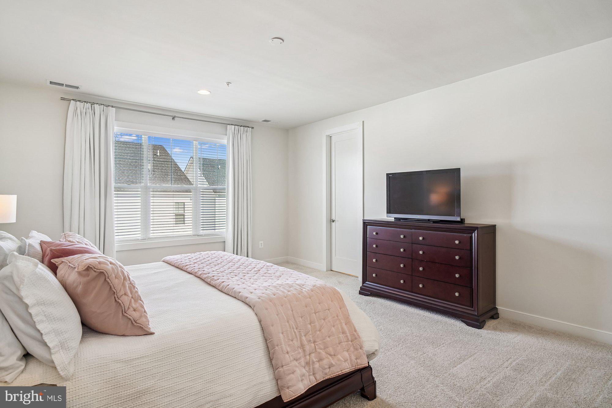 8776 Walnut Btm Lane Frederick, MD 21701 - Photo 20 of 39 a bedroom with a bed and a television