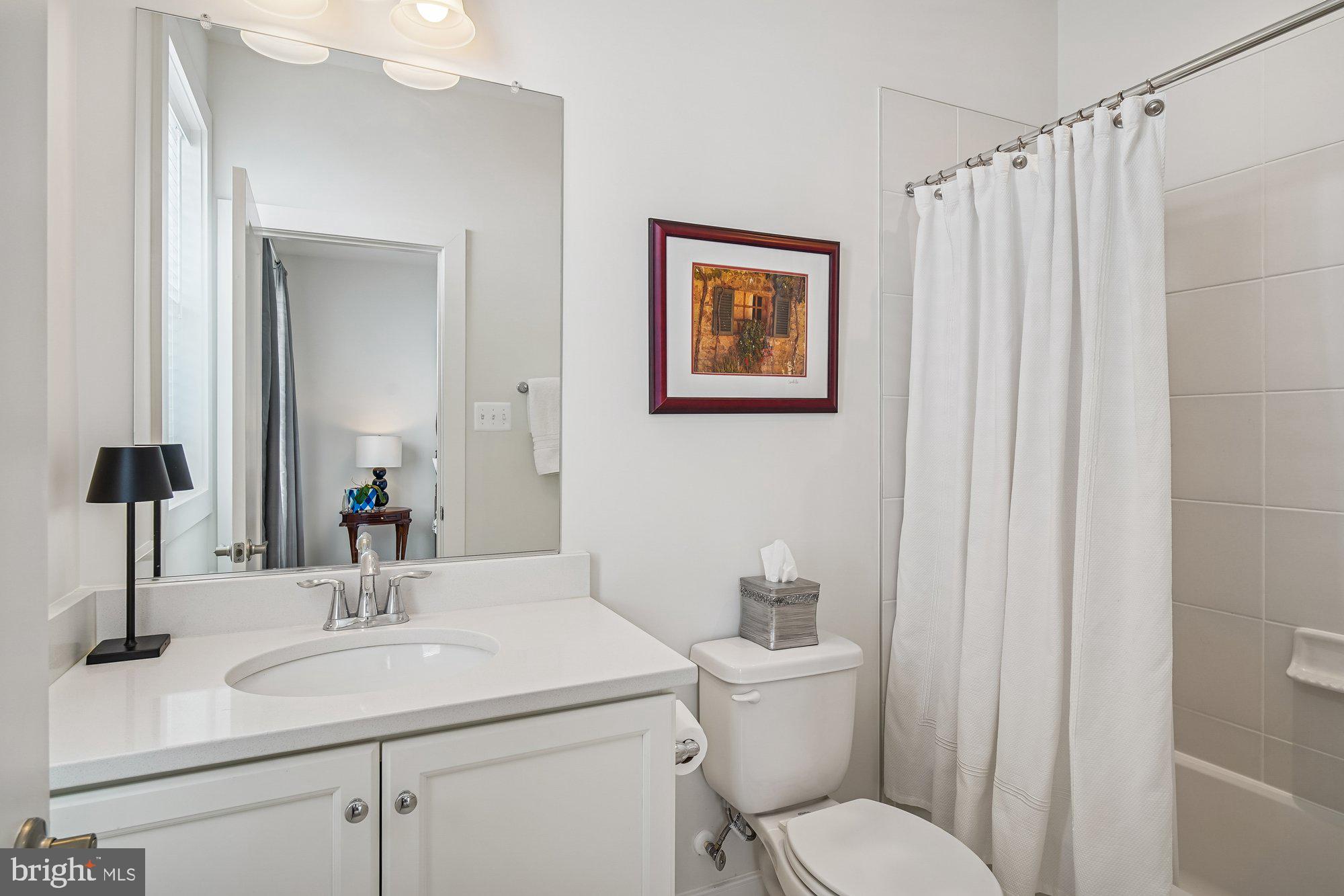 8776 Walnut Btm Lane Frederick, MD 21701 - Photo 25 of 39 a bathroom with a toilet sink and mirror