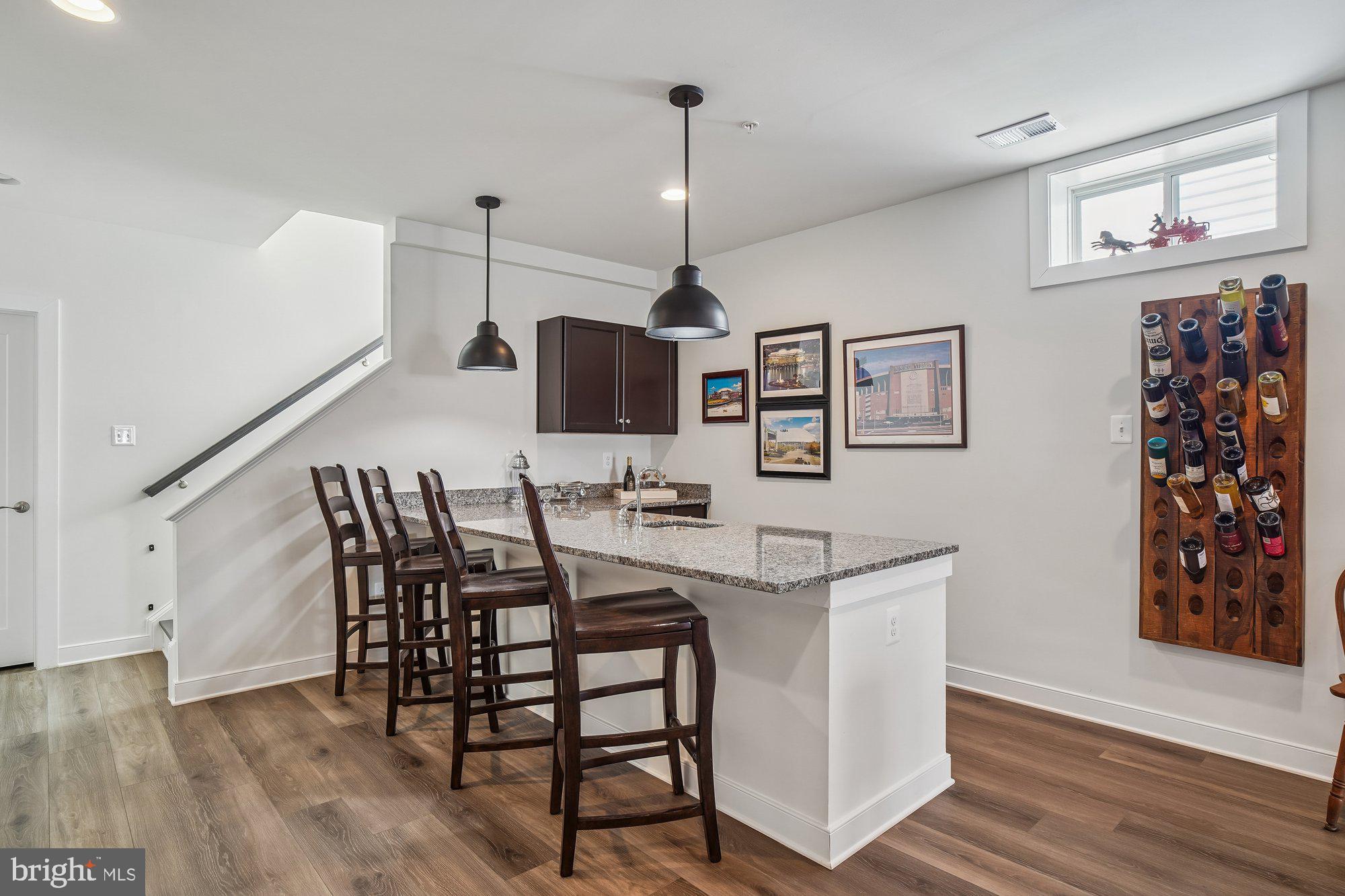 8776 Walnut Btm Lane Frederick, MD 21701 - Photo 33 of 39 a view of a dining room with furniture and wooden floor