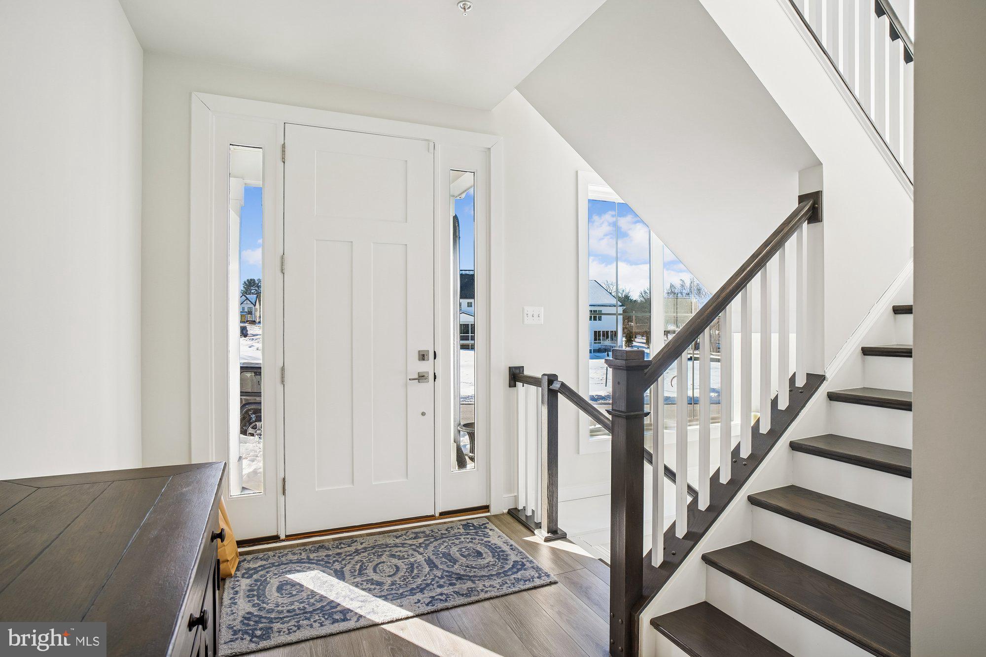 8776 Walnut Btm Lane Frederick, MD 21701 - Photo 7 of 39 a view of an entryway with wooden floor and staircase