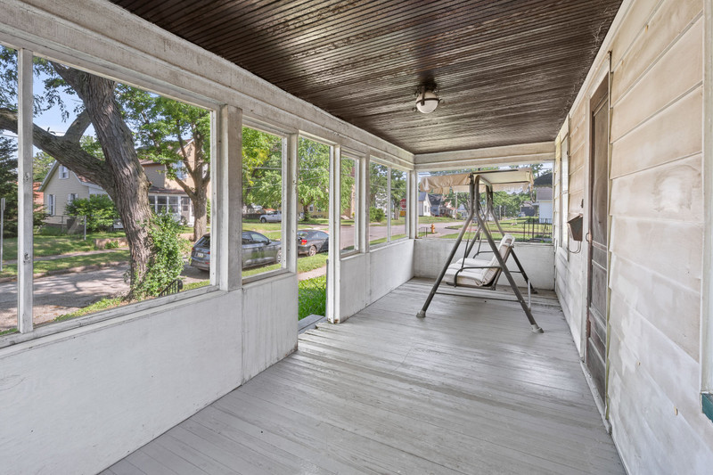 1419 17th Street Moline, IL 61265 - Photo 5 of 28 a view of empty room with wooden floor and glass door