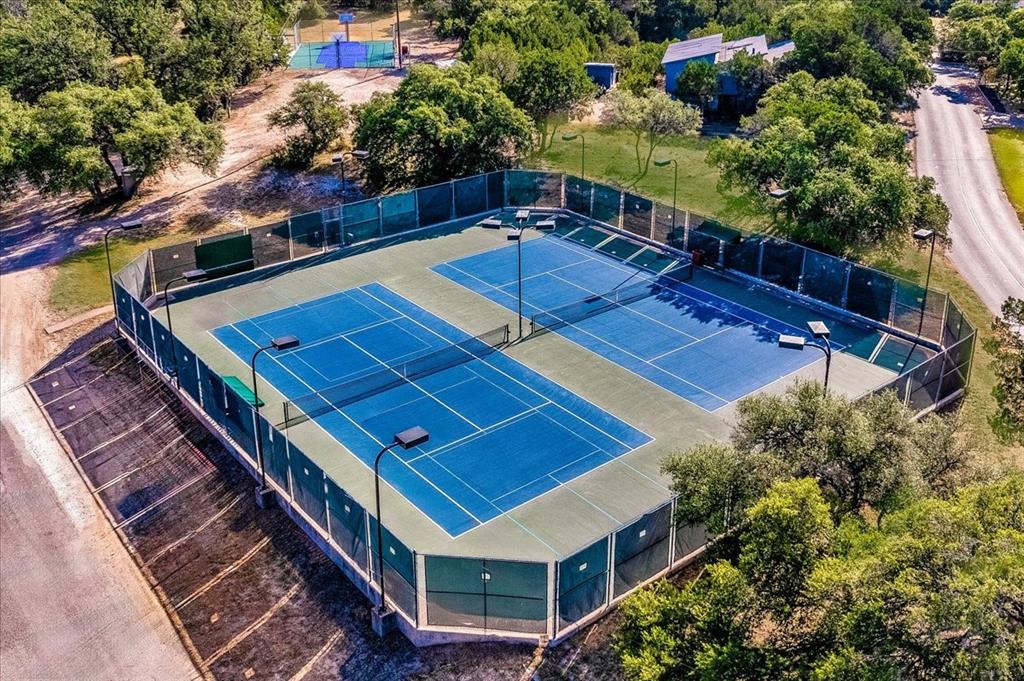 20600 Trinity Cove Lago Vista, TX 78645 - Photo 9 of 17 a view of a backyard with chairs and a potted plant
