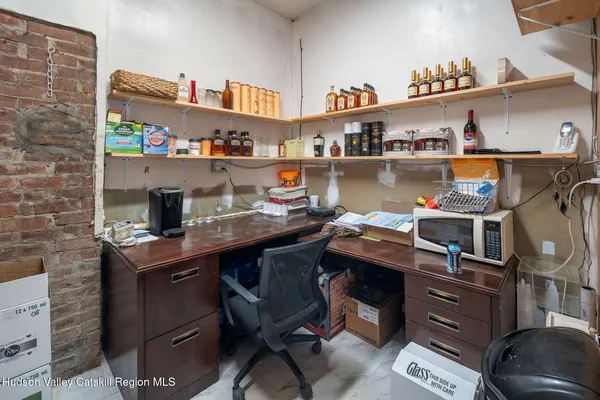 a room with stainless steel appliances a stove a sink and a refrigerator