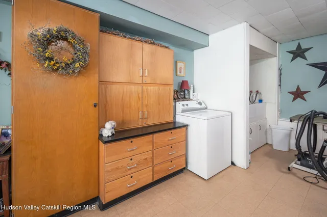 a bedroom with a bed and cabinets