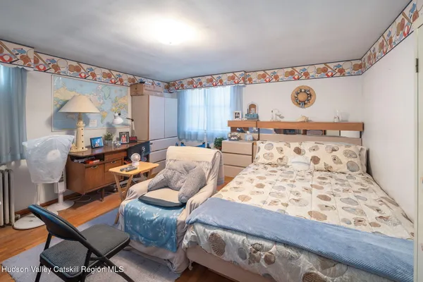a bed room with furniture and a window