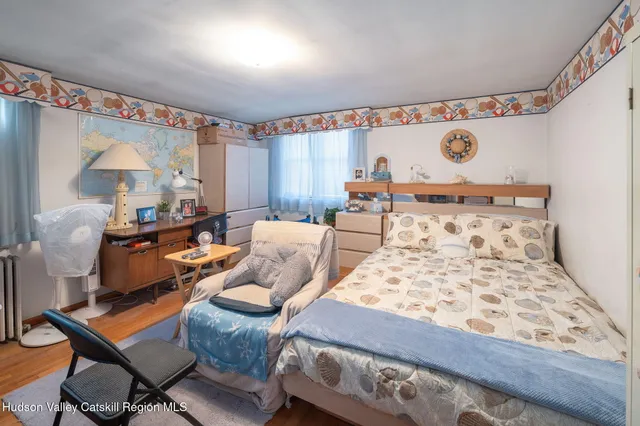 a bed room with furniture and a window