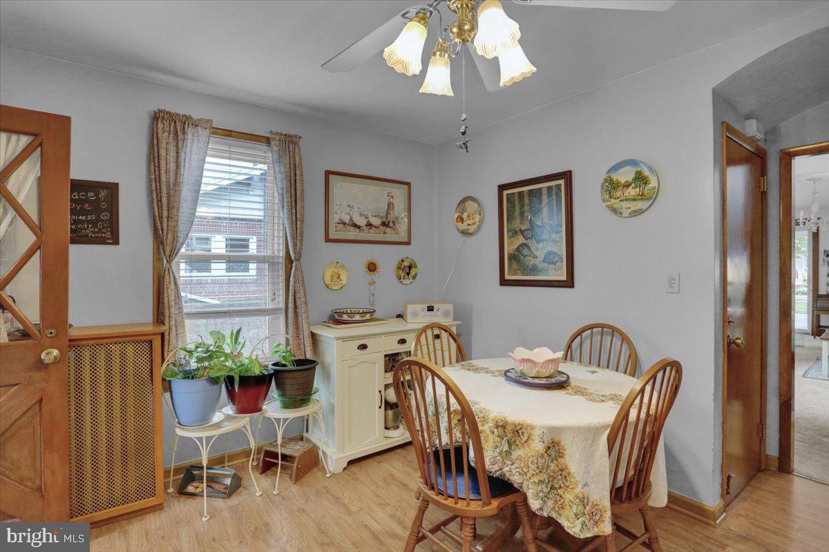 1322 Brooke Boulevard Reading, PA 19607 - Photo 12 of 36 a view of a dining room with furniture a chandelier and wooden floor
