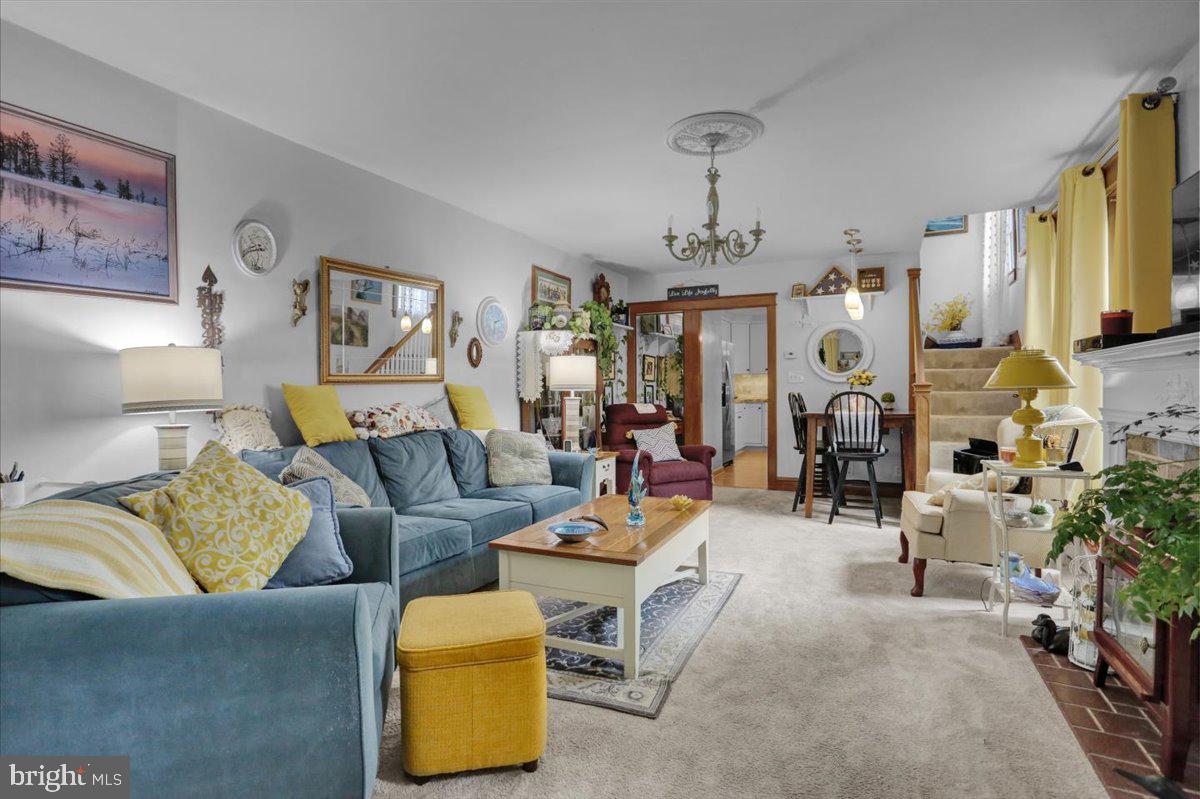 1322 Brooke Boulevard Reading, PA 19607 - Photo 6 of 36 a living room with furniture and a chandelier