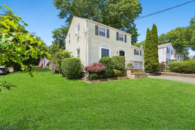 267 Kings Road Madison, NJ 07940 - Photo 28 of 37 a front view of a house with a garden and plants