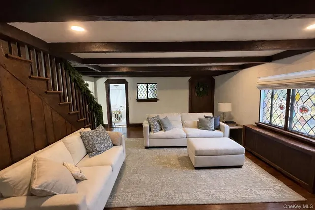 a living room with furniture and a window