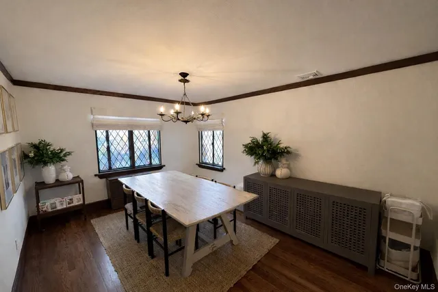 a view of a dining room with furniture and window