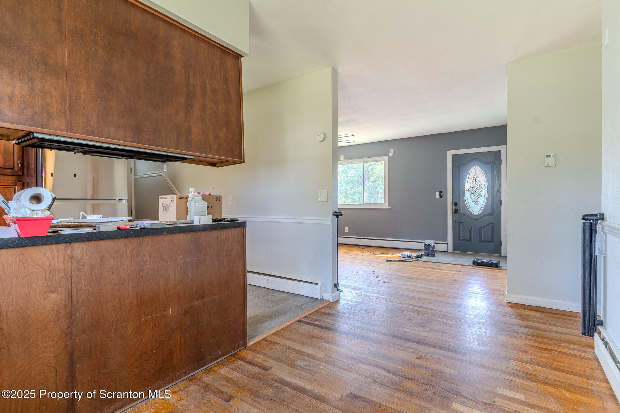 101 Sunset Road Dalton, PA 18414 - Photo 11 of 37 a view of a livingroom with wooden floor and staircase