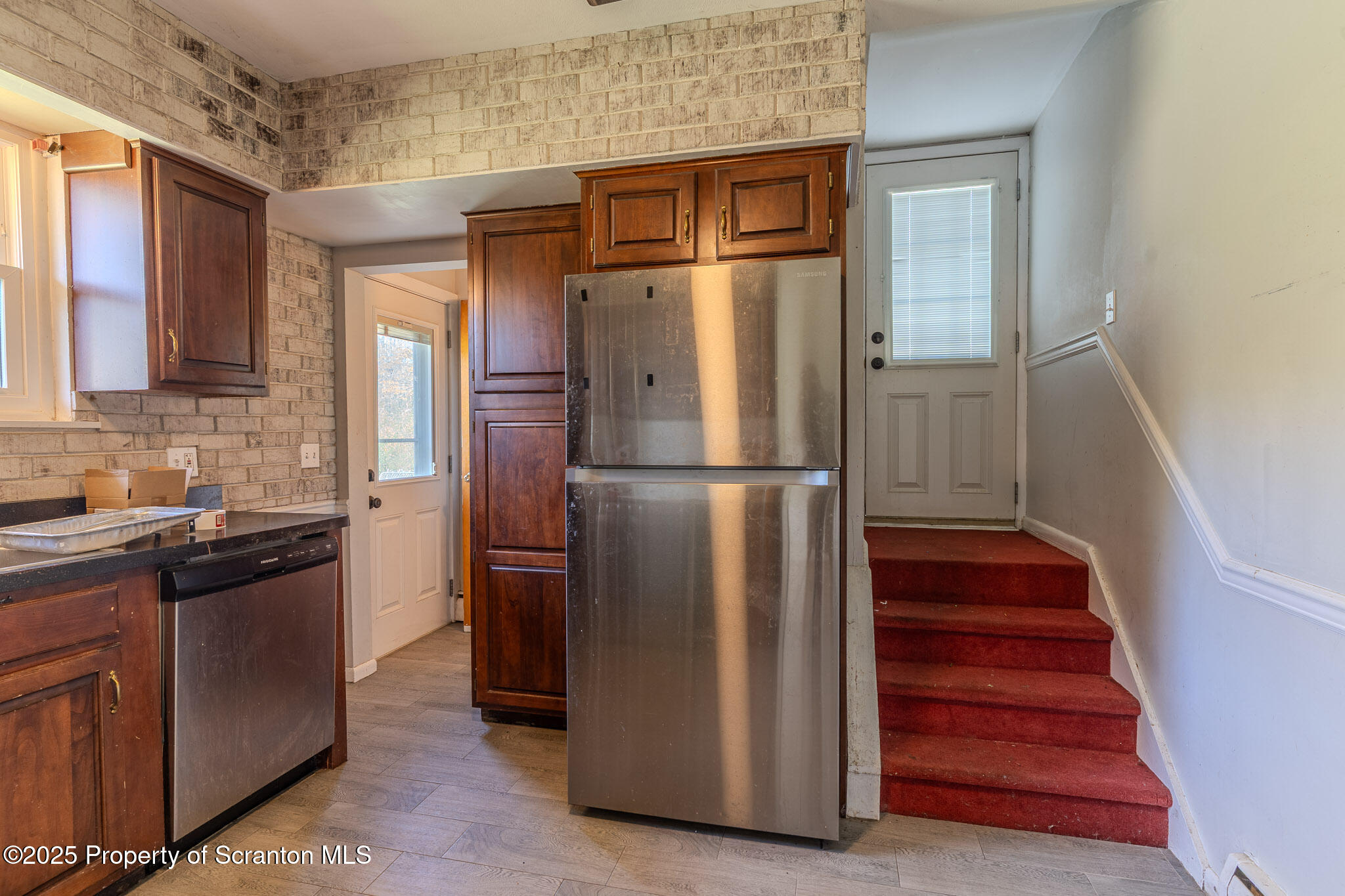 101 Sunset Road Dalton, PA 18414 - Photo 13 of 37 a kitchen with cabinets and stainless steel appliances