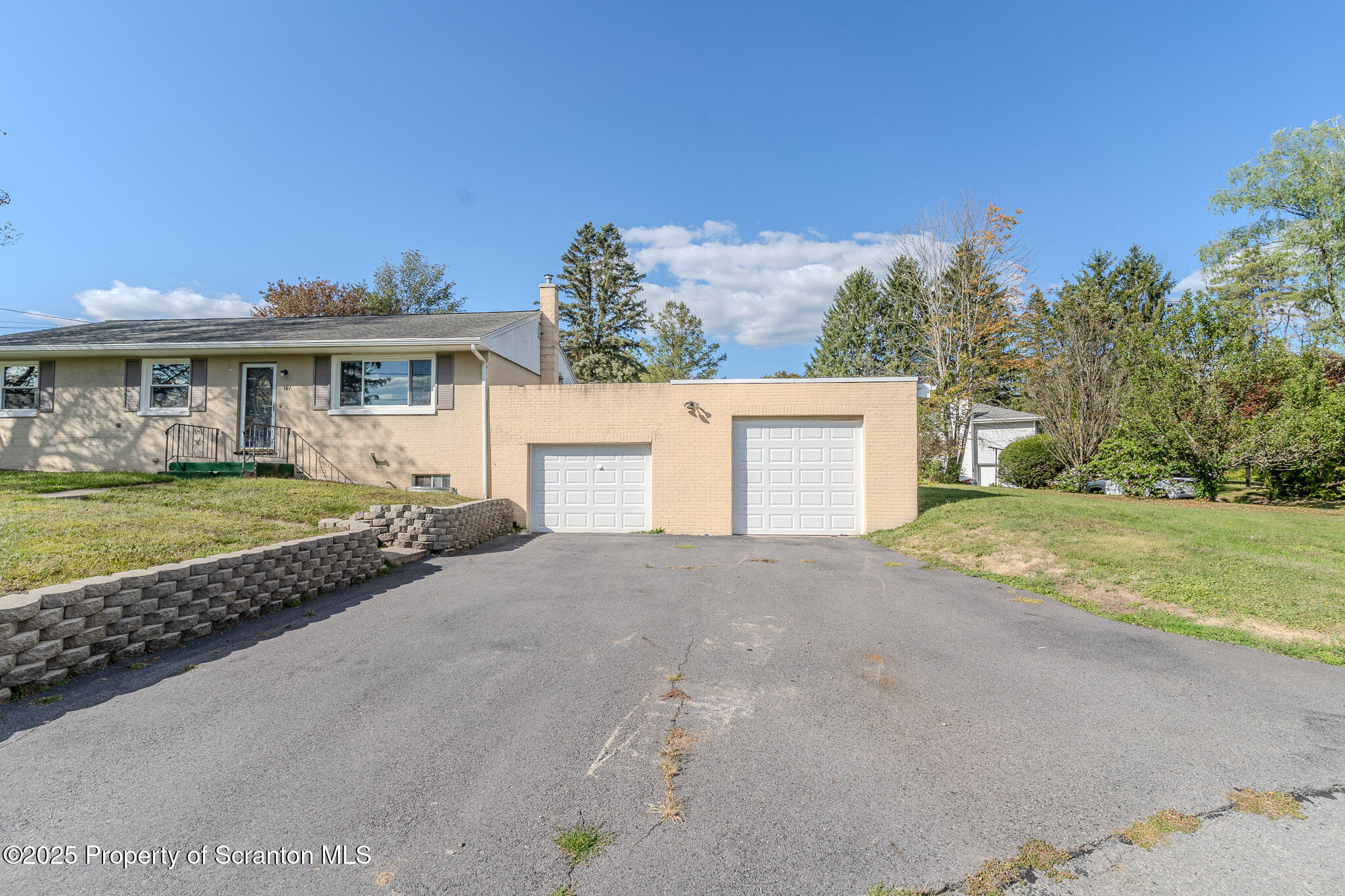 101 Sunset Road Dalton, PA 18414 - Photo 2 of 37 a view of a house with a yard and potted plants