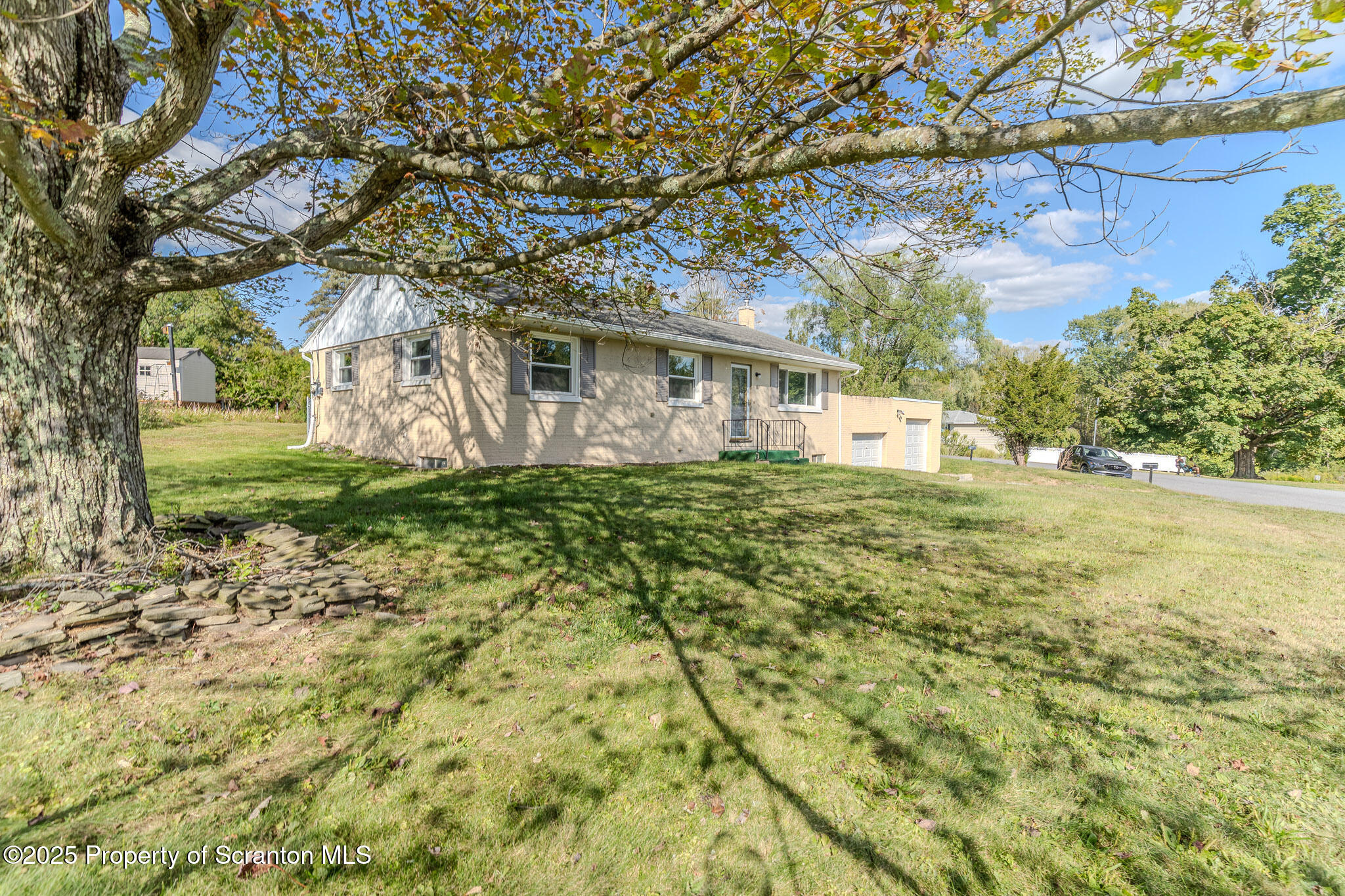 101 Sunset Road Dalton, PA 18414 - Photo 3 of 37 a front view of a house with a yard