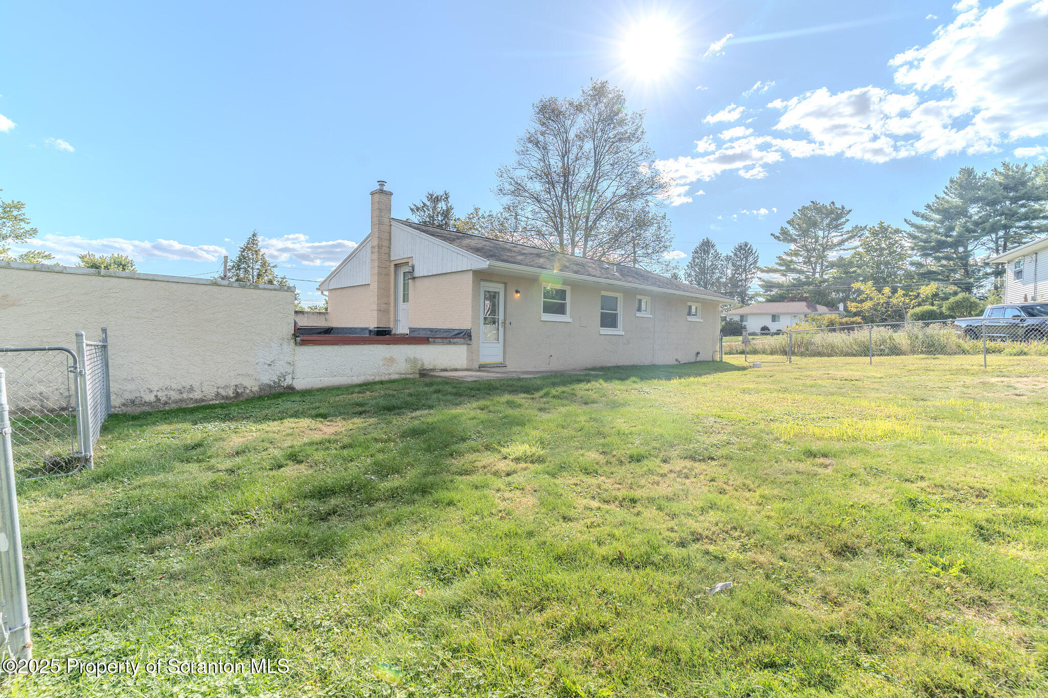 101 Sunset Road Dalton, PA 18414 - Photo 32 of 37 a view of a house with a yard and a large tree