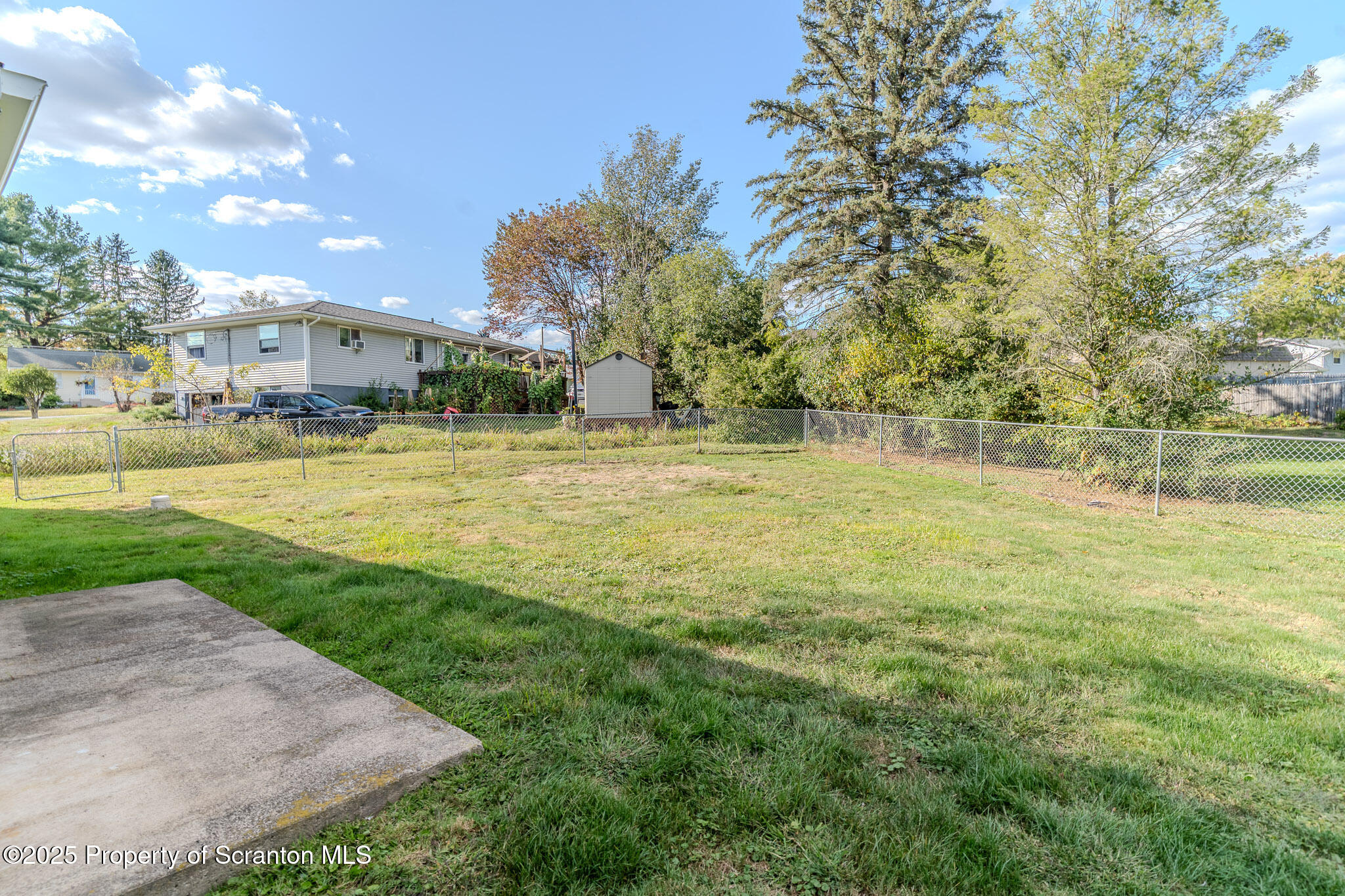 101 Sunset Road Dalton, PA 18414 - Photo 34 of 37 a view of a fountain in front of a house with a big yard