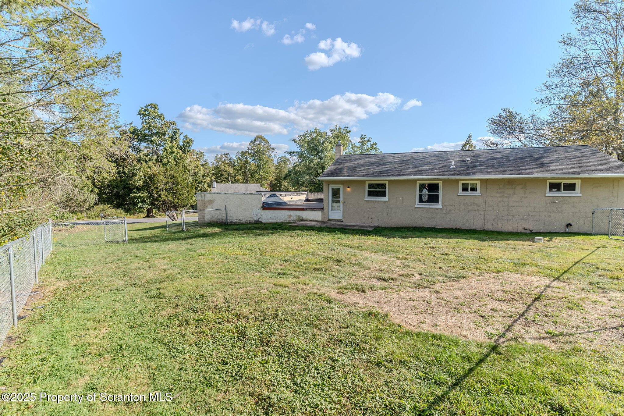 101 Sunset Road Dalton, PA 18414 - Photo 36 of 37 a view of a house with a backyard