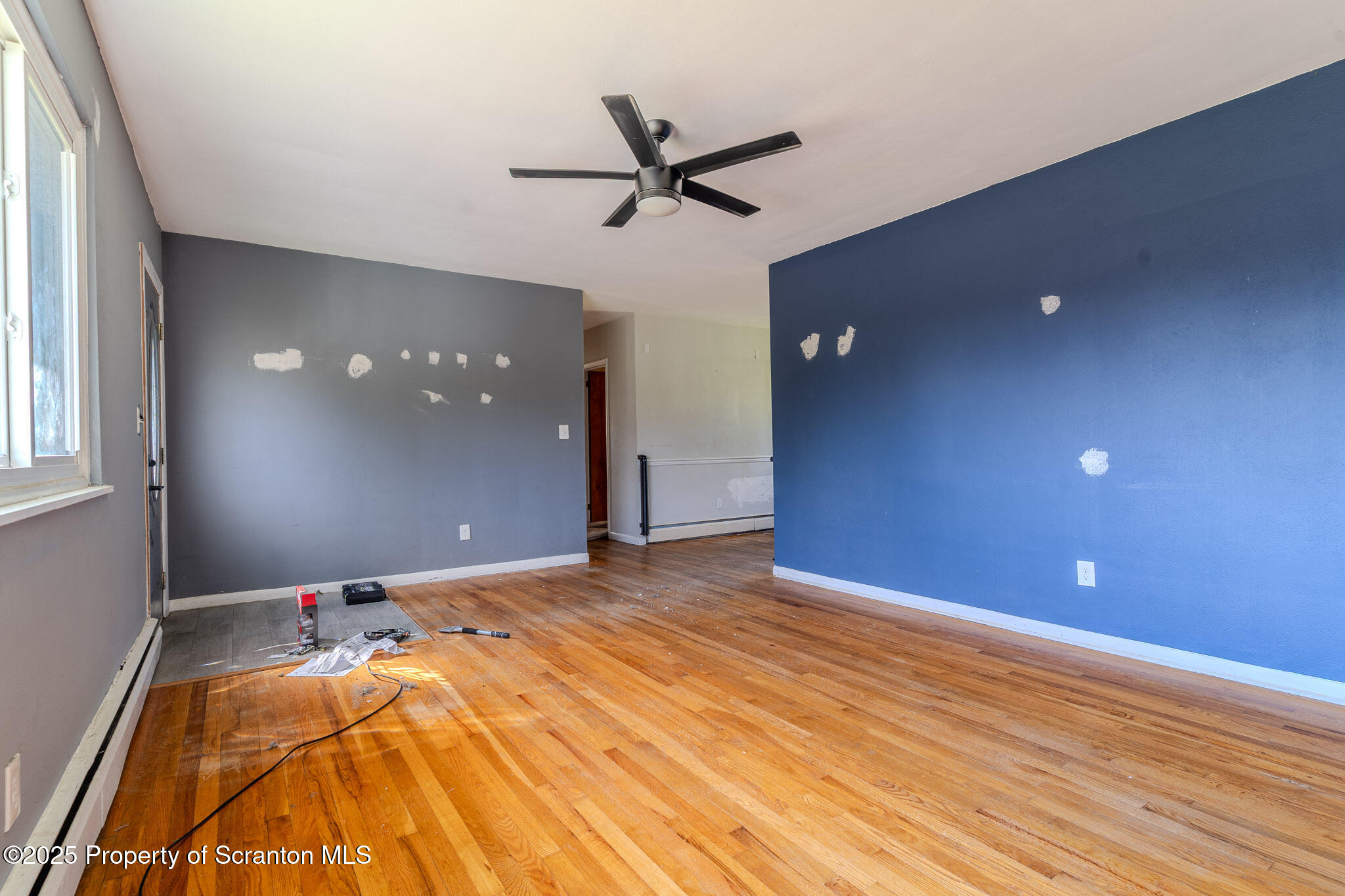 101 Sunset Road Dalton, PA 18414 - Photo 8 of 37 a view of a livingroom with a ceiling fan and window