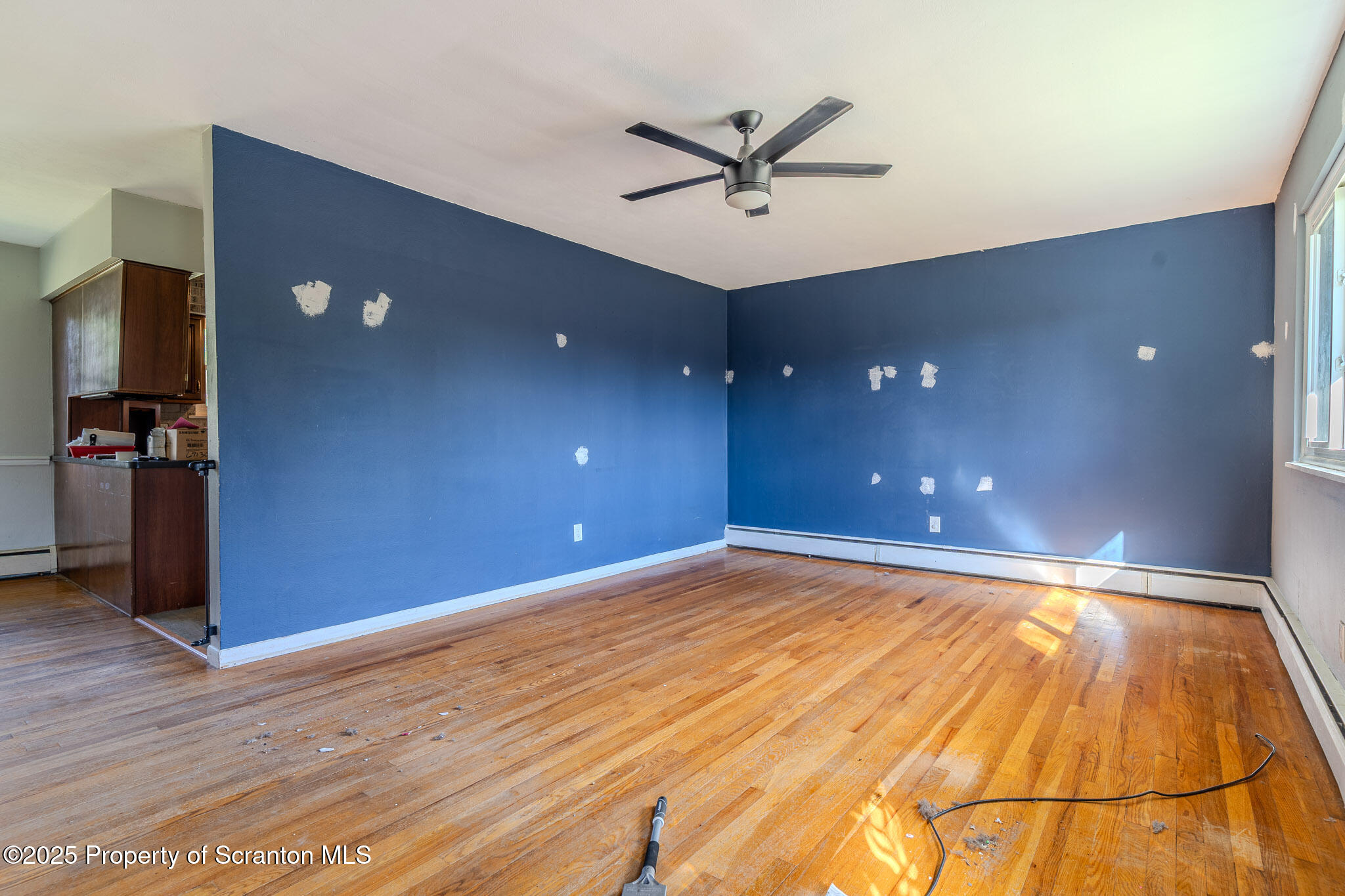 101 Sunset Road Dalton, PA 18414 - Photo 9 of 37 a view of a livingroom with a hall and wooden floor