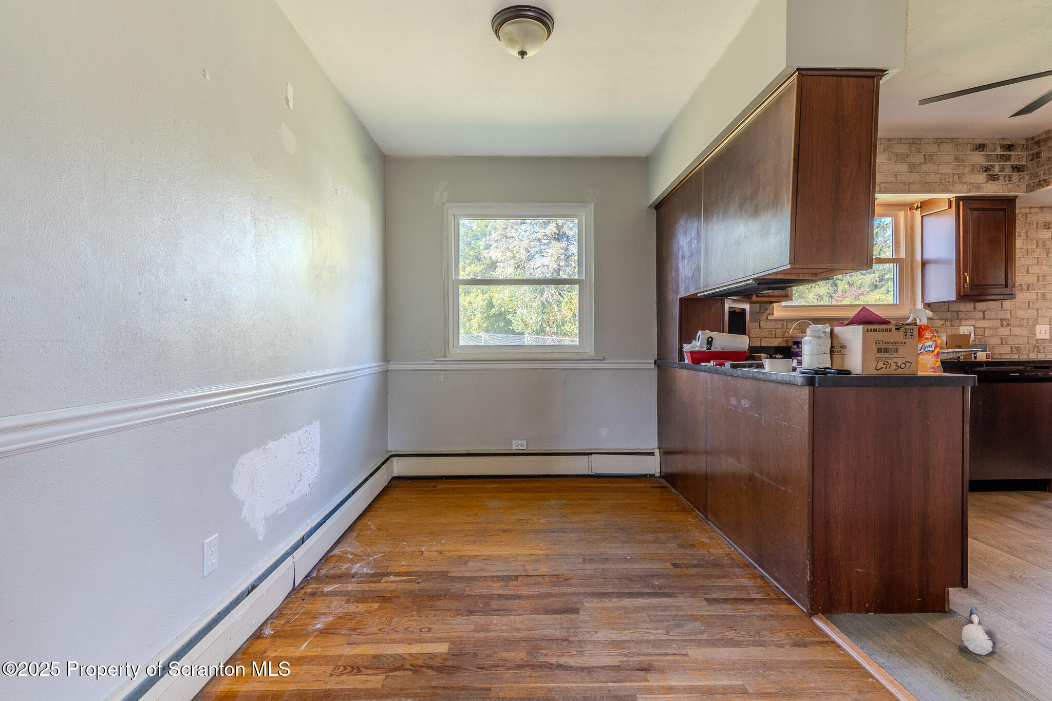 101 Sunset Road Dalton, PA 18414 - Photo 10 of 37 a view of kitchen with window and hardwood floor
