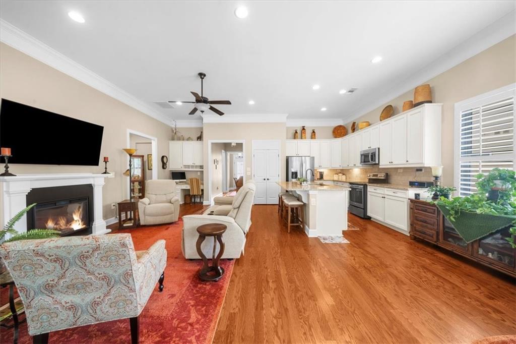 3880 Sweet Magnolia Drive Southwest Gainesville, GA 30504 - Photo 11 of 56 a living room with furniture fireplace and flat screen tv
