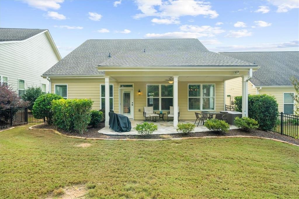 3880 Sweet Magnolia Drive Southwest Gainesville, GA 30504 - Photo 26 of 56 a front view of a house with swimming pool and glass windows