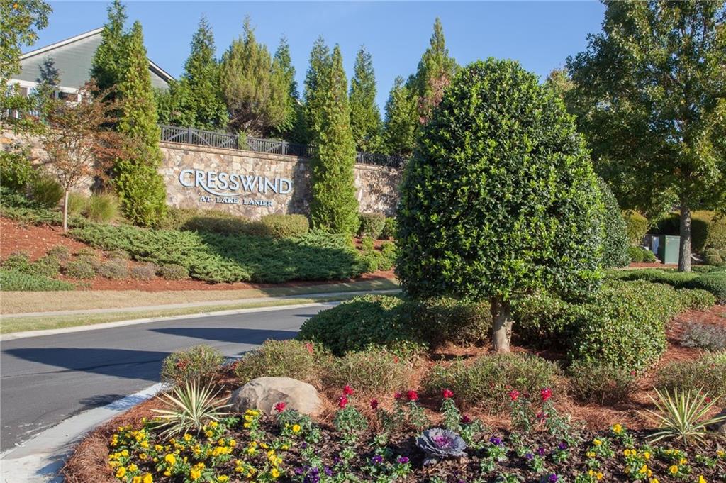 3880 Sweet Magnolia Drive Southwest Gainesville, GA 30504 - Photo 30 of 56 a sign that is sitting in front of flowers
