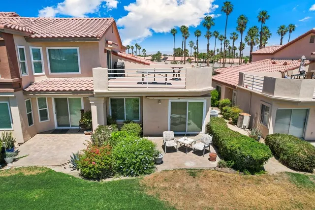 front view of a building with a garden