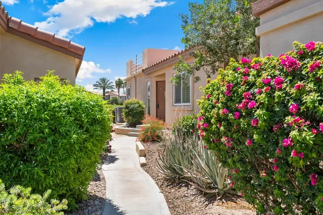 a flower plants in front of a house