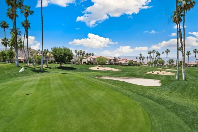 a view of a golf course with a lake