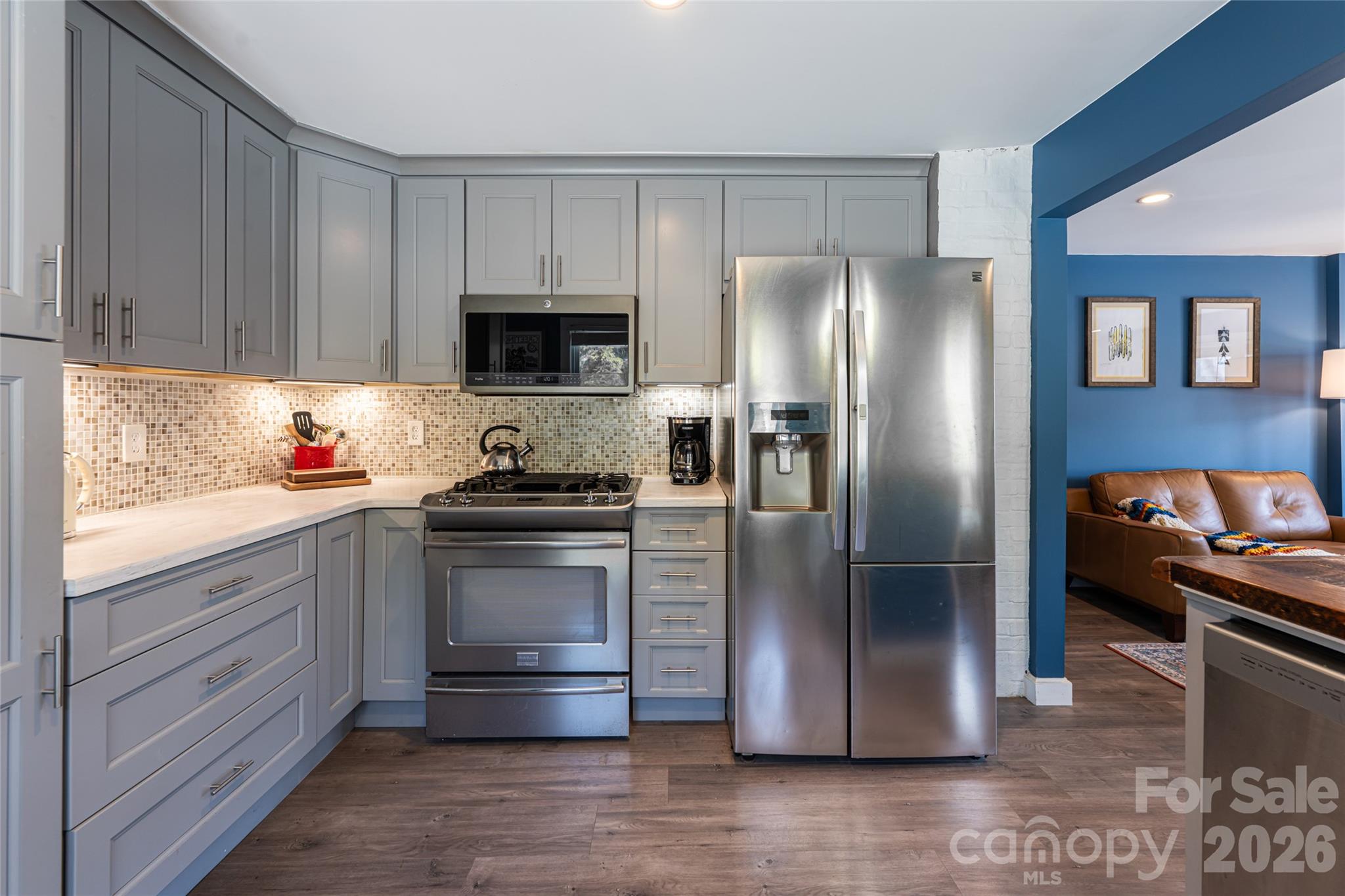 86 Rolling Hills Road Canton, NC 28716 - Photo 13 of 48 a kitchen with stainless steel appliances granite countertop a refrigerator stove and sink