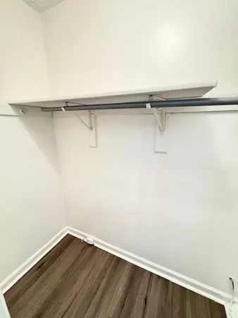 a view of a room with shelf on the wall