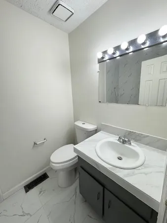 a bathroom with a sink and a toilet