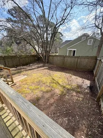 a view of a backyard of the house
