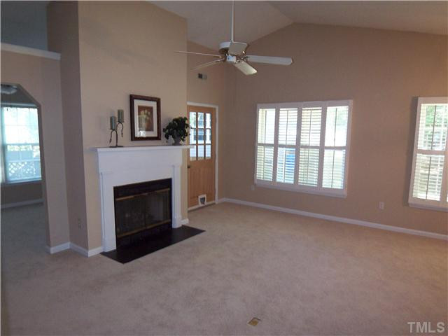 118 Timber Ridge Drive Durham, NC 27713 - Photo 3 of 12 Living Room is also open to a "den" area which would be perfect for a home office or reading room! Door from living room leads to screen porch access to deck! Gas log fireplace provides perfect place to cozy up to on a fall evening! Living Room