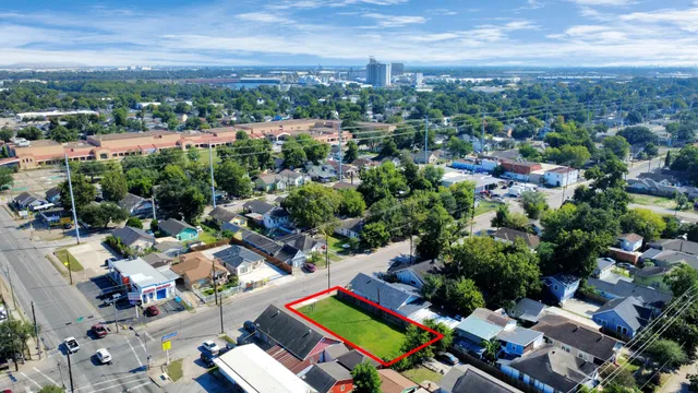 an aerial view of a house with a garden and swimming pool