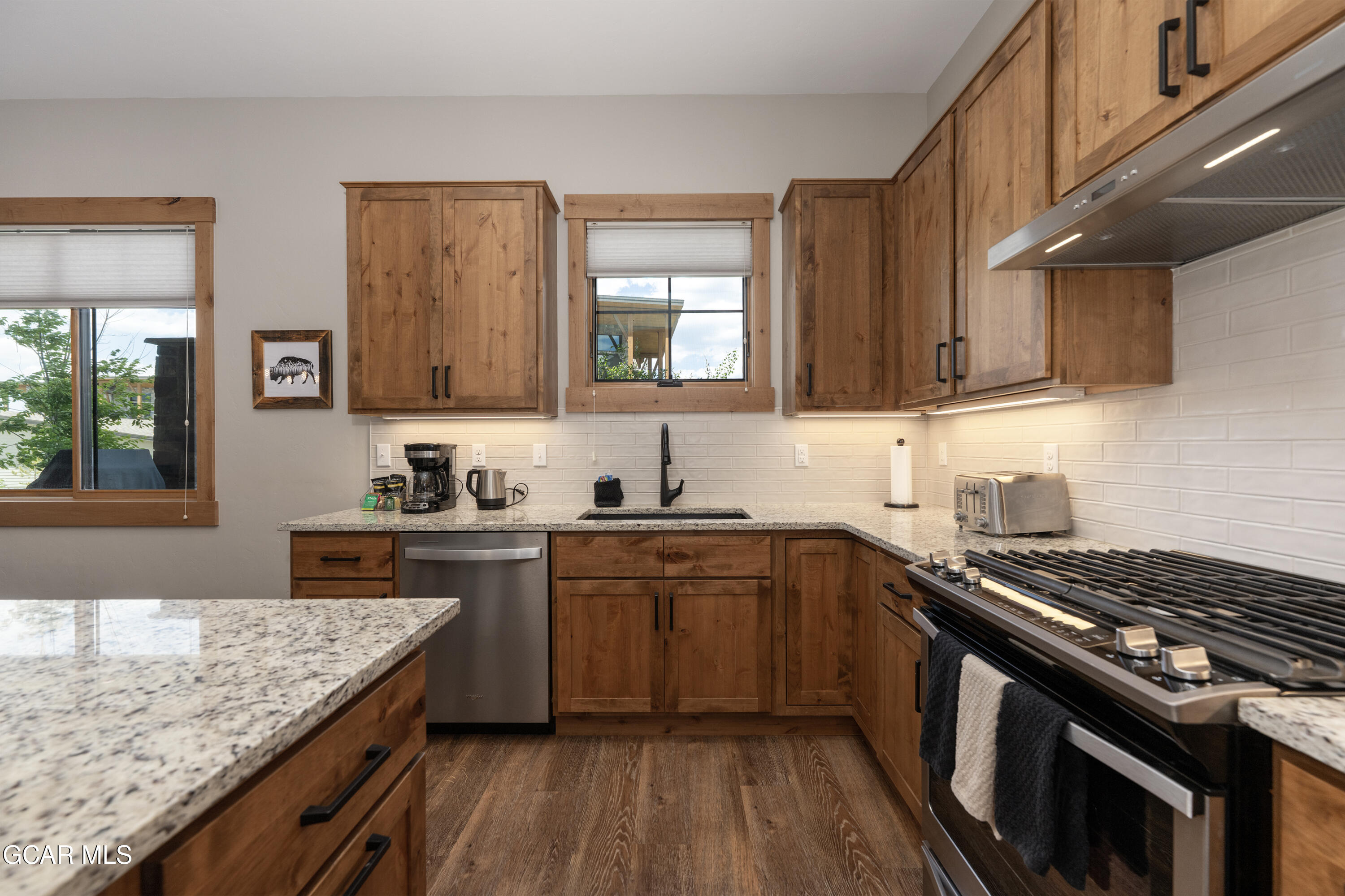 40 Springview Lane Fraser, CO 80442 - Photo 6 of 36 a kitchen with a stove sink and cabinets