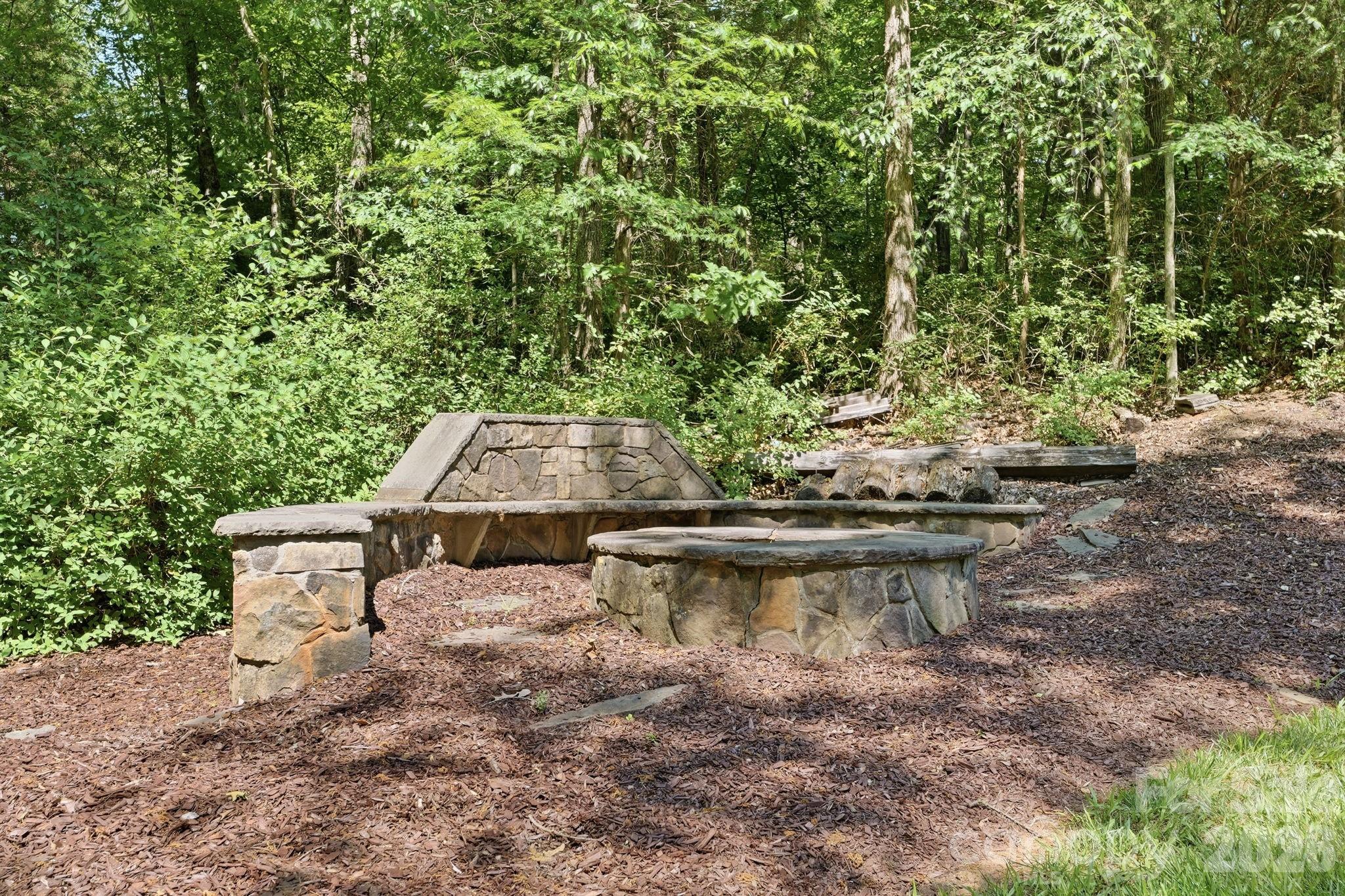 235 Grey Road Davidson, NC 28036 - Photo 39 of 42 a view of a backyard with water fountain and outdoor seating