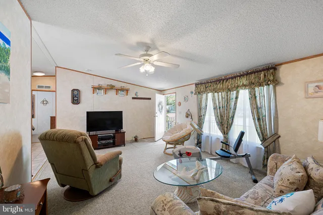 a living room with furniture fireplace and a flat screen tv