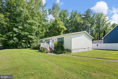 a view of a backyard of the house