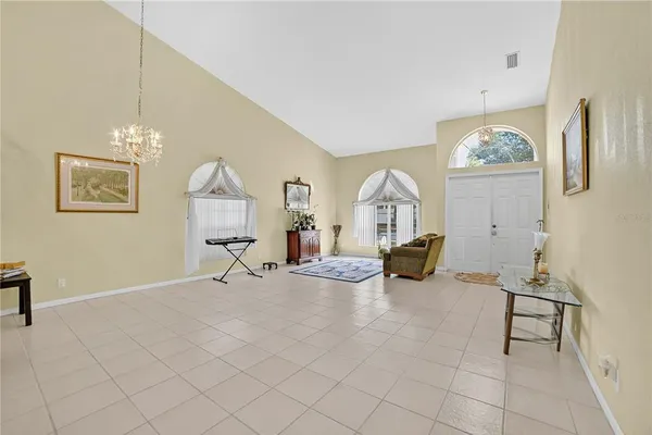 a view of a livingroom with furniture and a chandelier