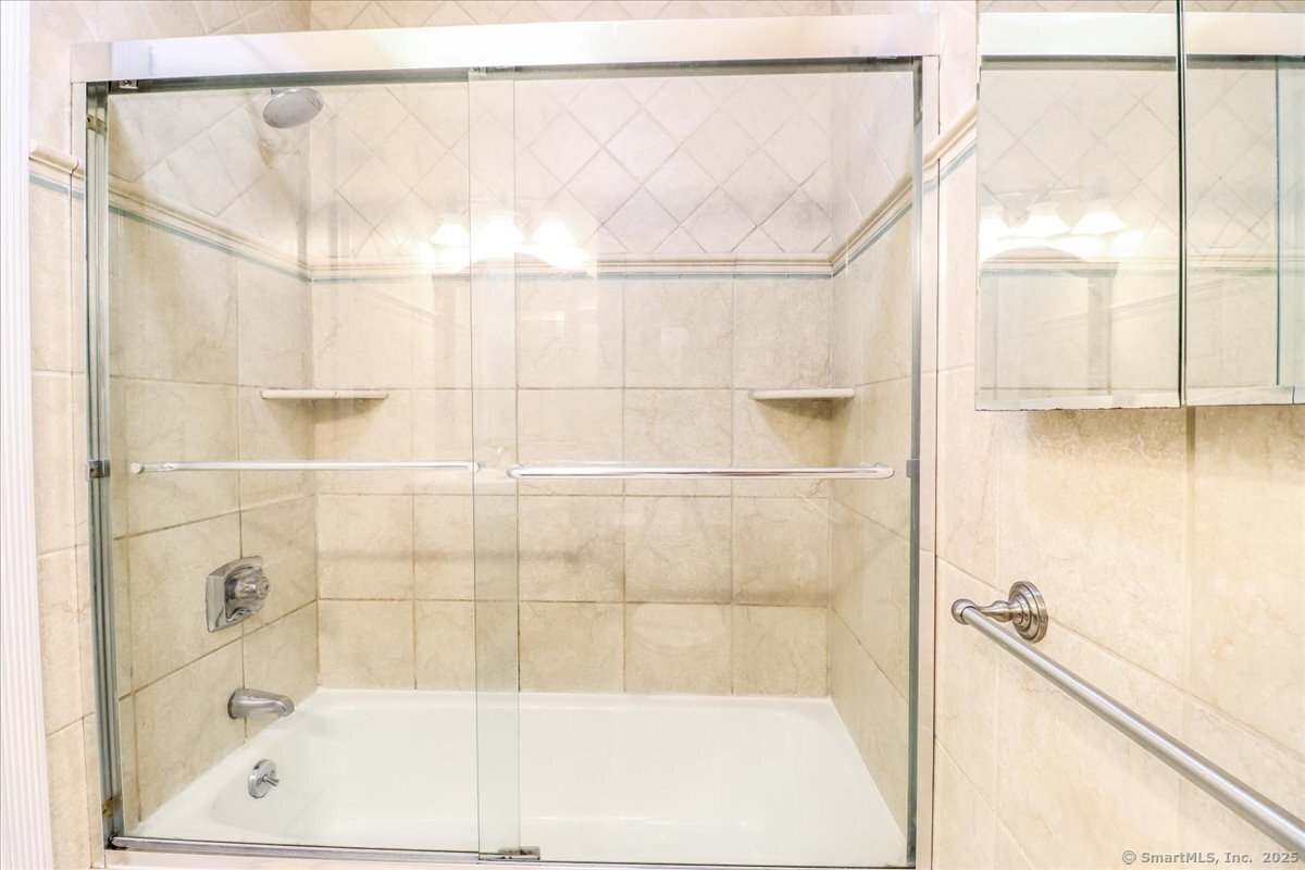 65 Ellsworth Street, Unit 302 Bridgeport, CT 06605 - Photo 18 of 40 a bathroom with a shower and a bathtub