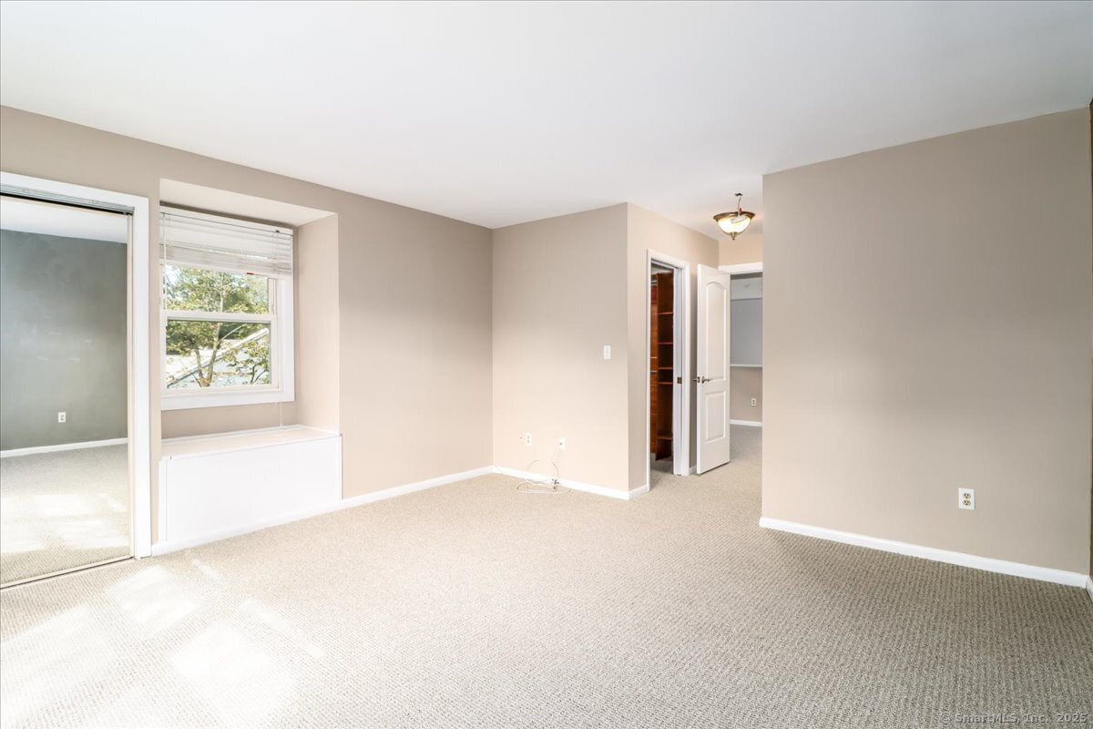 65 Ellsworth Street, Unit 302 Bridgeport, CT 06605 - Photo 25 of 40 a view of an empty room with a window