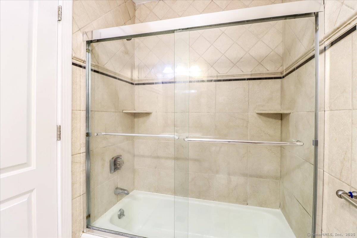 65 Ellsworth Street, Unit 302 Bridgeport, CT 06605 - Photo 28 of 40 a bathroom with a shower and a bathtub